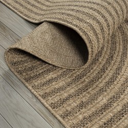 Flat woven indoor/outdoor rug with a modern rounded graphic pattern, durable and easy to clean.