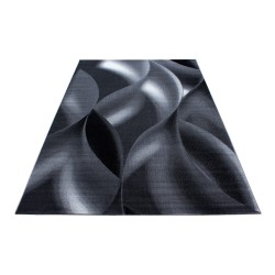 Modern designer living room rug with short pile wave pattern, black and grey